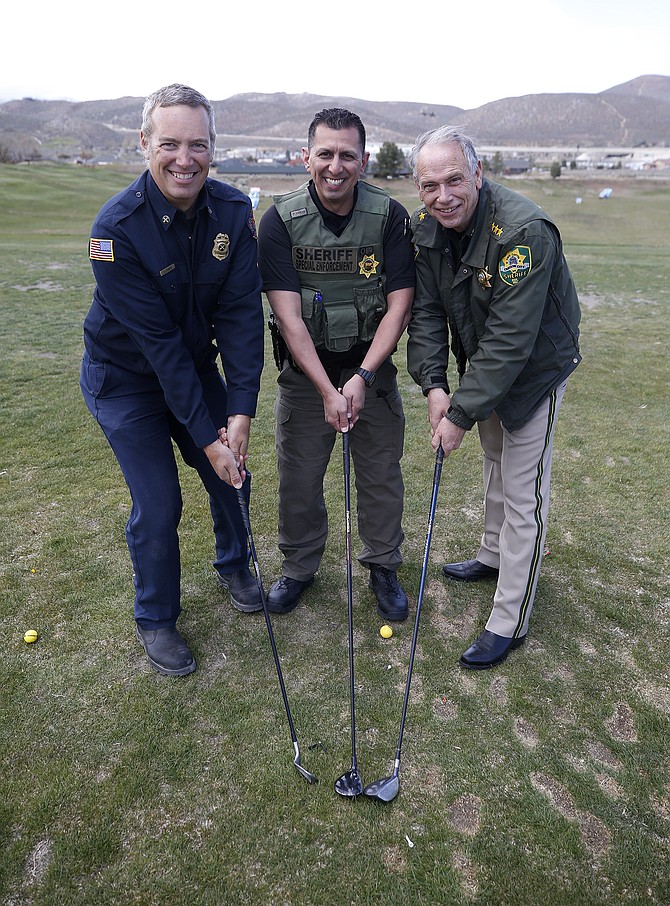 Carson City Fire Battalion Chief Jason Danen, Carson City Sheriff’s Capt. Daniel Gonzales and Sheriff Kenny Furlong promote the upcoming Holiday with a Hero golf tournament.