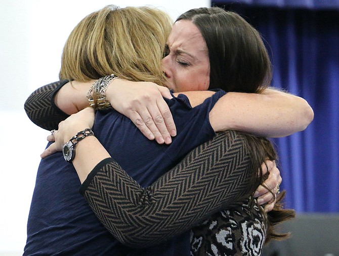 Empire Elementary School Principal Susan Squires hugs STEM coach Adrienne Wiggins on Tuesday after she was named the Carson City School District’s Educator of the Year.