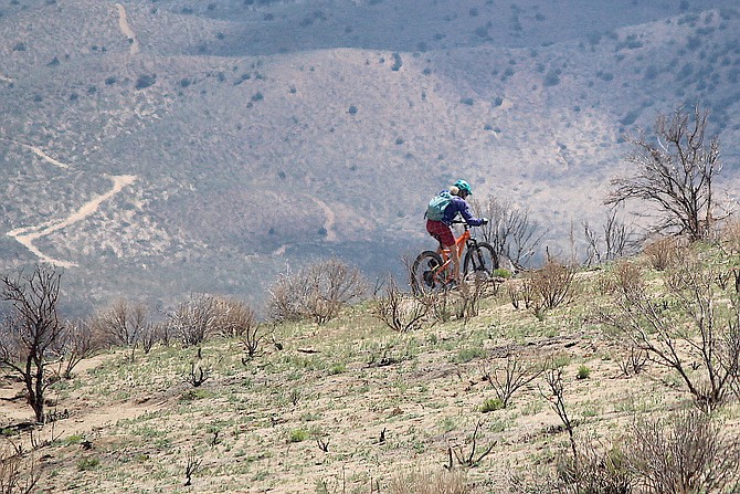 A mountain biker tackles the hill above Jacks Valley Road where some of the new trail is being built by the Carson Valley Trails Association.