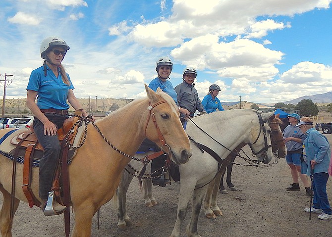 Members of the Douglas County Sheriff's Mounted Posse greet the public at a membership drive and benefit for Animal Rescue Relay on Saturday at the Douglas County Fairgrounds.