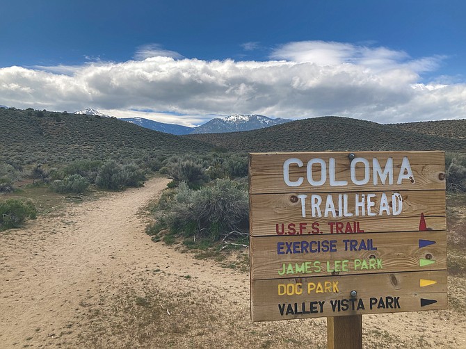 The Coloma Trailhead sign is seen at the beginning of the trail.