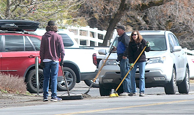 Genoans sweep their streets on April 23. Spring cleaning spread to Gardnerville on Saturday.