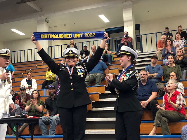 Carson High School Battalion Commander Cadet Diana Pierrott, left, with Executive Officer Cadet Allison Gerow share the excitement with the battalion cadets after the unit received the Distinguished Unit with Honors Award.