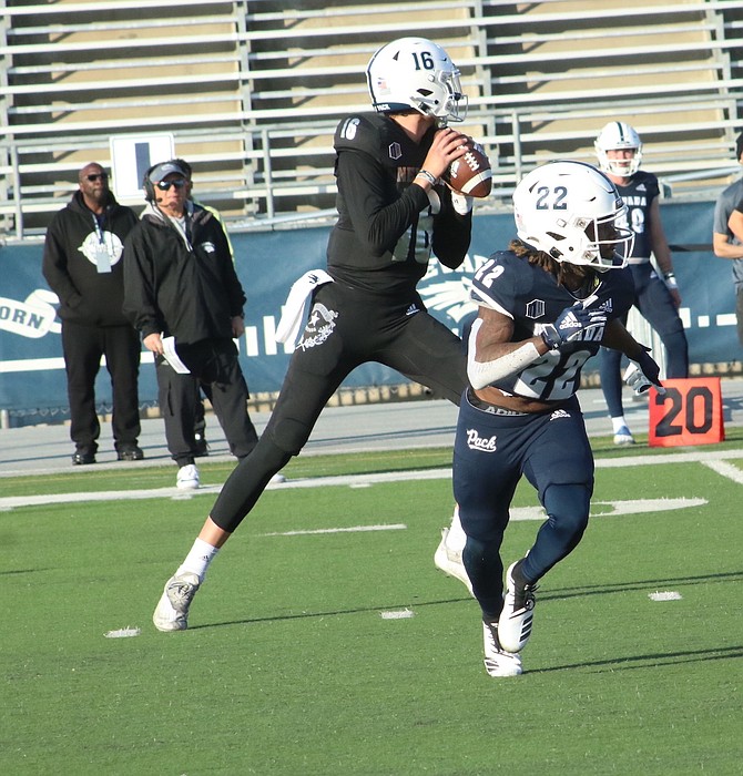 Nate Cox (16) and Cross Patton (22) during the football team’s spring game April 23 in Reno.