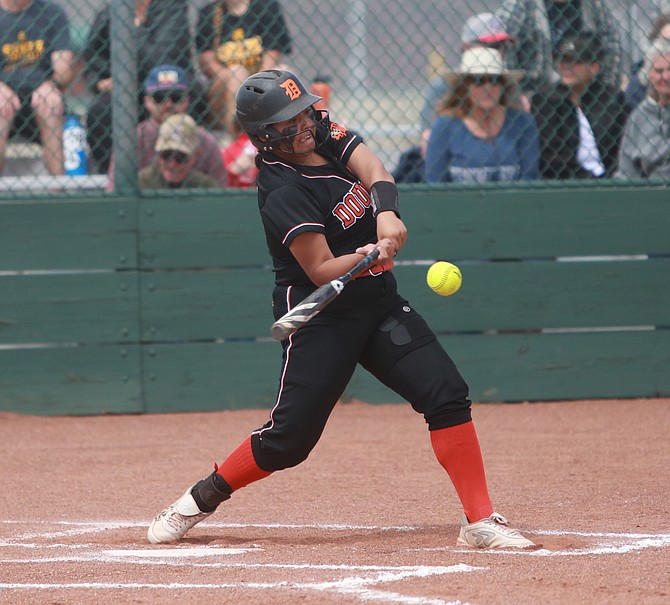 Douglas High's Bri Williams turns on one of her two hits Thursday afternoon against Reno.