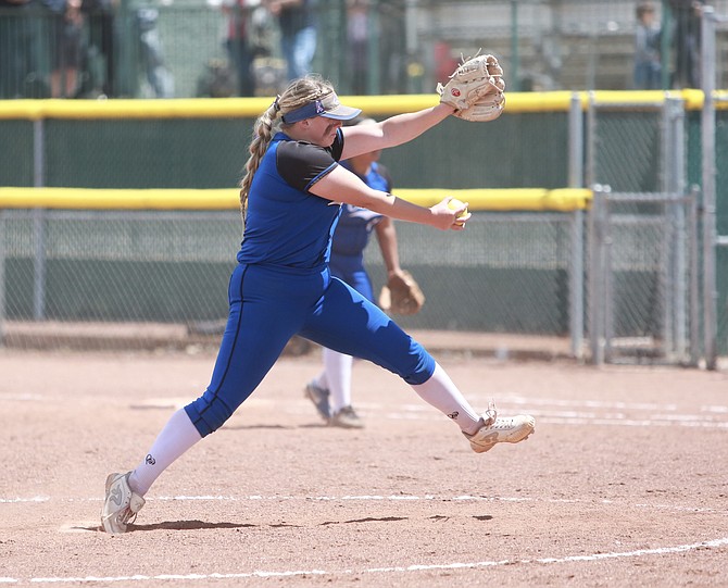 Caydee Farnworth winds up to throw against Reed in the opening round of the regional softball tournament Thursday afternoon at Bishop Manogue.