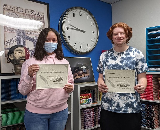 CHS B4 students Laura Vazquez and AJ Bezama celebrate their wins in the Fantasy short story interclass writing competition