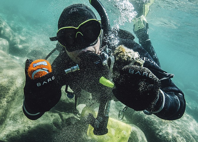 Clean Up The Lake diver Colin West shows debris found in Lake Tahoe from an initial dive in 2020.