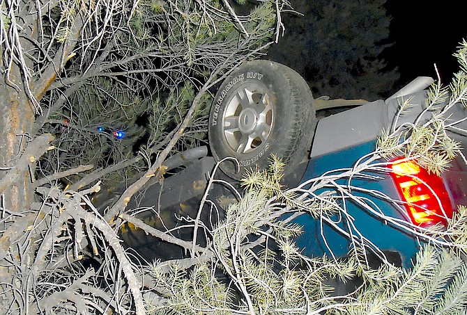 A Ford Explorer came to rest in the brush just south of Double Spring Flat in the Pine Nuts on May 8. The driver was ejected. Nevada State Police photo