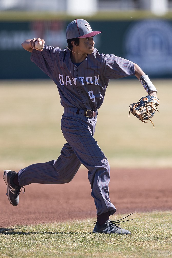 Dayton High freshman Edgar Landa winds up to throw to first base against Douglas High earlier this season. Landa and the Dust Devils made the Class 3A state tournament for the first time since 2010.