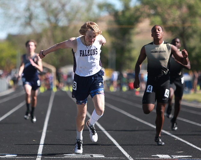 Sierra Lutheran junior sprinter, Flynn Scheibe, crosses the line in first place to win the Class 1A 400-meter dash state title at Reed High School over the weekend.