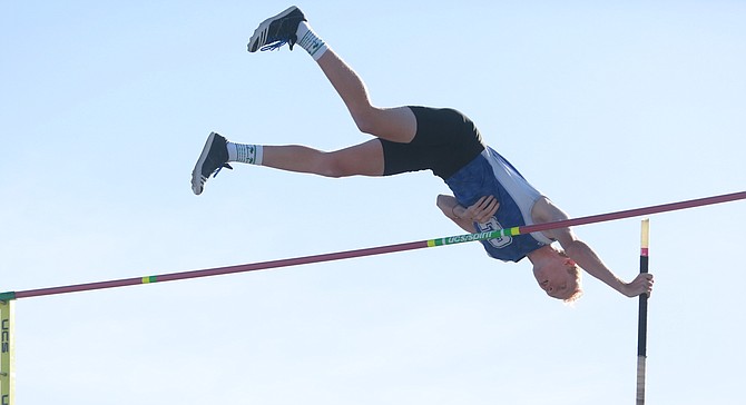 Carson High pole vaulter Kai Miller clears 15 feet at the Class 5A state track and field meet at Reed High School on Friday. Miller won the state title to cap his Senator career.