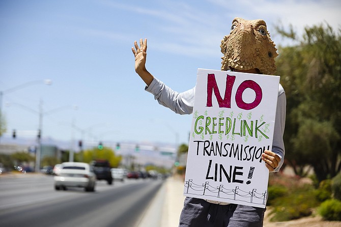 Mojave Green Founder Shannon Salter, wearing a horned lizard mask, protests the NV Energy Greenlink Nevada Transmission Line project May 16, 2022, in Las Vegas.