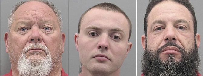 Richard John Devries (L-R), Russell Smith, and Stephen Alo following their arrest and booking on May 30, 2022, on felony attempted murder, battery and weapon charges in a shooting on a Las Vegas-area freeway.