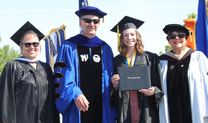 From left, WNC Interim Vice President of Academic and Student Affairs Dana Ryan, WNC Interim President J. Kyle Dalpe and NSHE Regent Carol Del Carlo, far right, pose with Kailyn Sorensen, second from right.