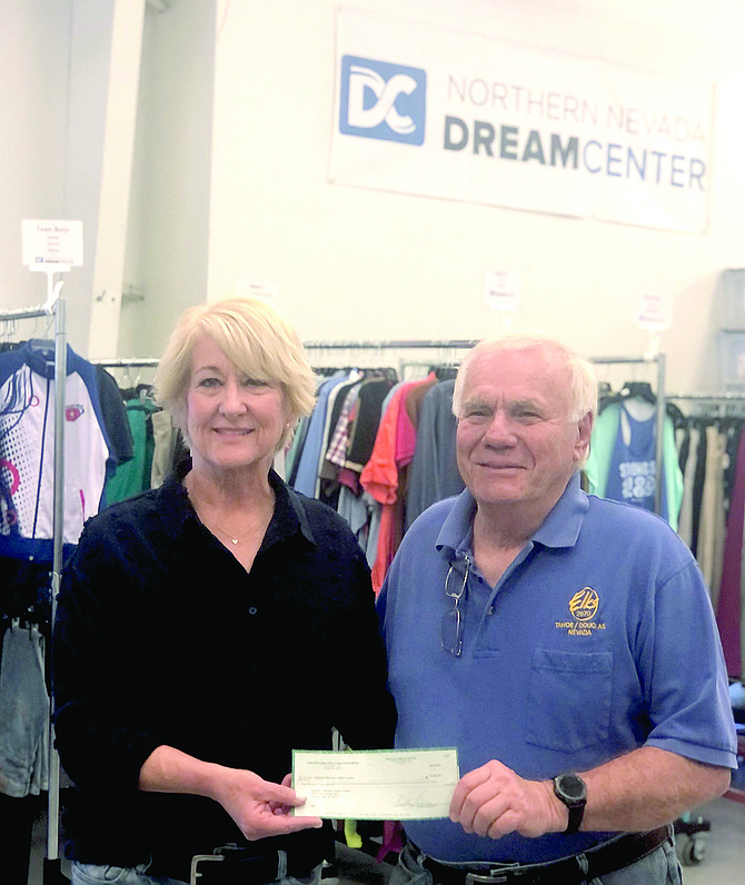 Northern Nevada Dream Center Director Susan Sorenson accepts a $2,000 check from Tahoe-Douglas Elks Past Exalted Ruler Jim Plamenig.