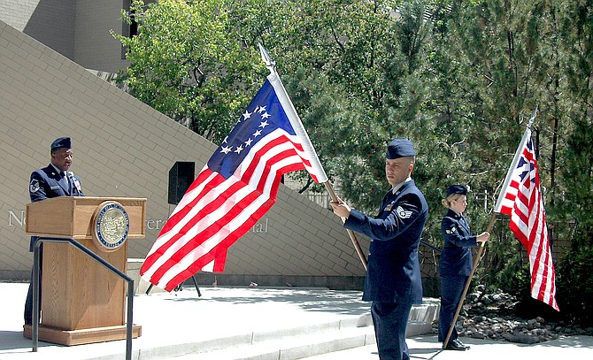 An historical American flag is part of the National Guard's Birthday and Flag Day celebration.
