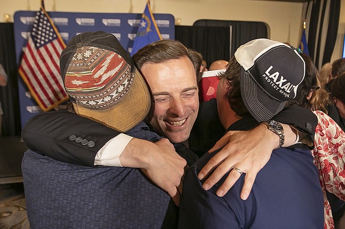 Nevada Republican U.S. Senate candidate Adam Laxalt celebrates his victory with family, friends and supporters at the Tamarack Casino in Reno on June 14, 2022.