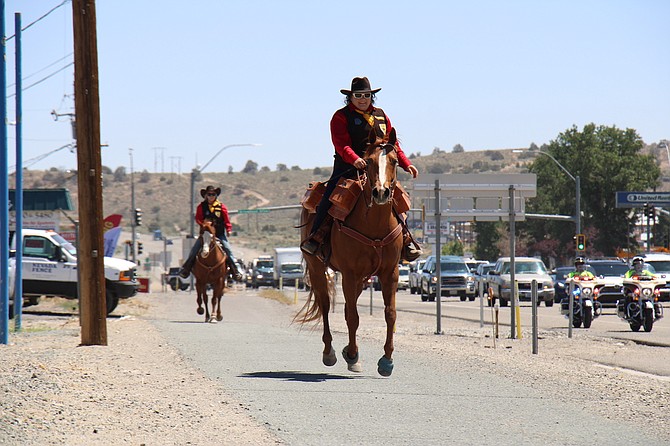Pony Express riders received a police escort down Highway 50 on June 15, 2022.