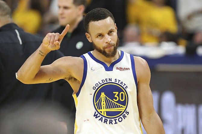 Golden State guard Stephen Curry celebrates during Game 5 of the NBA Finals against Boston in San Francisco on June 13, 2022.
