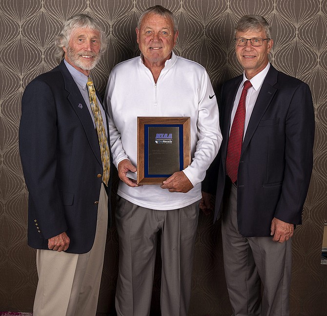 Former Virginia City basketball player and Incline High School coach Rollie Hess, center, was inducted into the Nevada Interscholastic Athletic Association’s Hall of Fame on June 10. With him are Jerry Hughes, left, retired NIAA executive director, and Bart Thompson, right, current executive director.