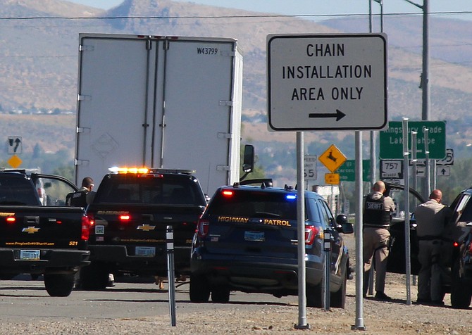 Law enforcement officers were ready if the driver of a semi took off, after a license plate reader indicated the truck was stolen on Thursday morning. It wasn't and the driver was released to continue on his way.