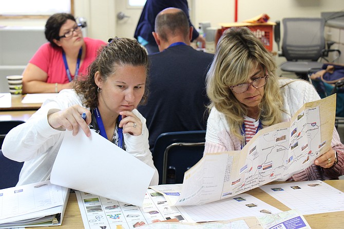 Sara Whitney and Debra Winkelman, both teachers at Bethlehem Lutheran School, look at a map of mines in Nevada.