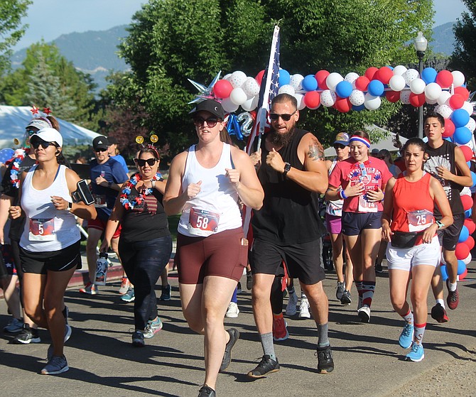 Runners participate in the  Freedom 5K Fun Run on July Fourth 2021 in Heritage Park in Gardnerville.