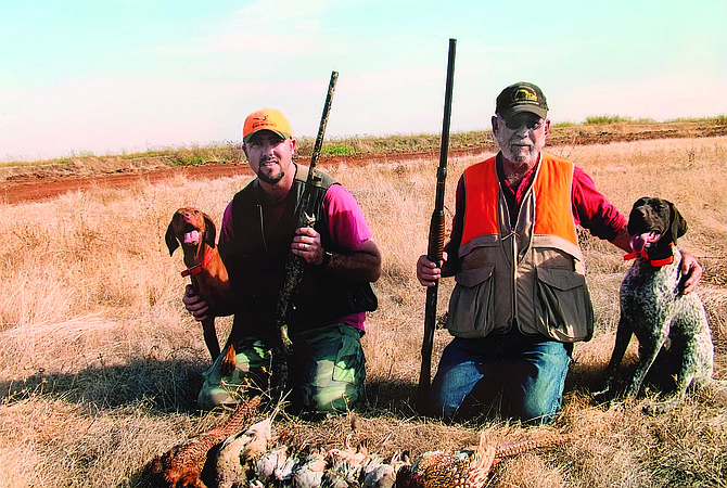Oldest son George Robert, with Gary and his dog Sierra Rose on one of their hunting trips.