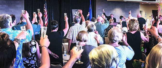 Community Services Director Scott Morgan leads a toast to Douglas County volunteer Bob Cook during a celebration of life held on Saturday at the Community & Senior Center in Gardnerville.