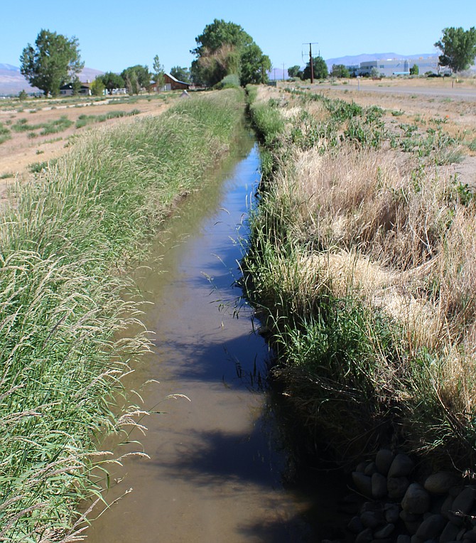 A little bit of water flows in an irrigation ditch along Heybourne Road on Wednesday morning. A dry year could result in ranchers using supplemental groundwater rights to grow their crops.