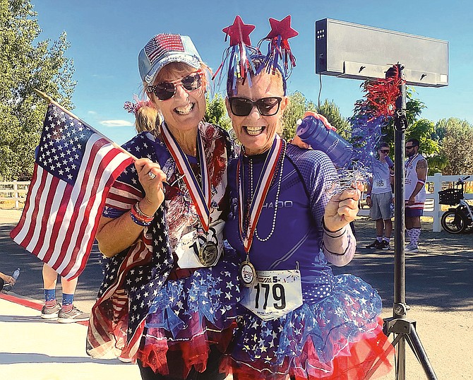 Cathy Ramage and Ingred Mann won most spirited at the Main Street Gardnerville Freedom 5k Run.