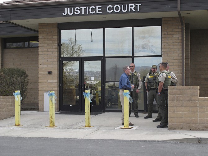 Law enforcement officers outside Justice Court in Fernley on April 8, 2022