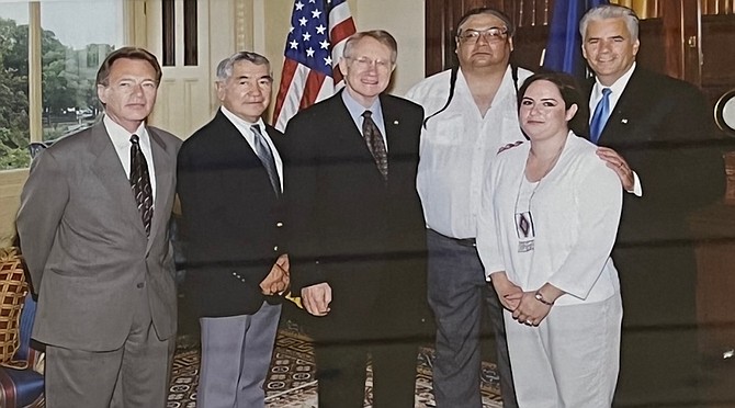 Former Fallon Paiute Shoshone Tribe chairman Alvin Moyle, second from left, with former Sens. Harry Reid, center, and John Ensign, right.