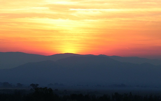 A bright orange sunrise over Carson Valley on Saturday morning thanks to smoke from a fire burning near Yosemite.