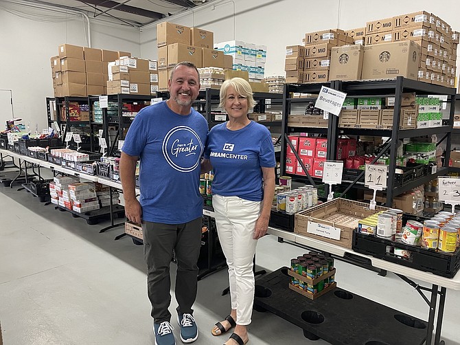 Wally Murray (left), president and CEO of Greater Nevada, tours the Northern Nevada Dream Center with Susan Sorenson, the organization’s founder.