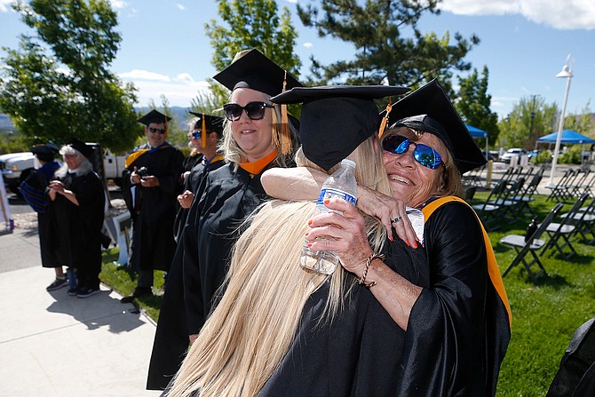 Edda Gibson hugging a graduate during WNC’s 2021 commencement.