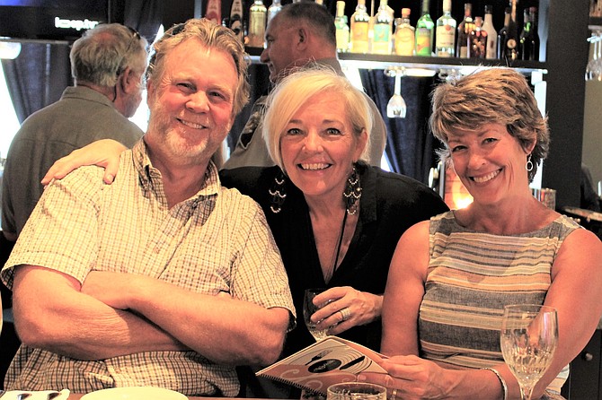 Nashville Social Club co-owner Kitty McKay (center) welcomed builder Mark 
Beauchamp and his wife Roni on the opening night of the new eatery.  Much of the remodel was completed by Shaheen Beauchamp Builders.