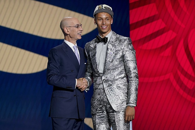 Dyson Daniels, right, is congratulated by NBA Commissioner Adam Silver after being selected eighth overall by the New Orleans Pelicans in the NBA draft on June 23, 2022, in New York.