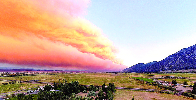 The smoke plume that announced the Tamarack Fire stretches across the sky in Carson Valley on July 16, 2021.