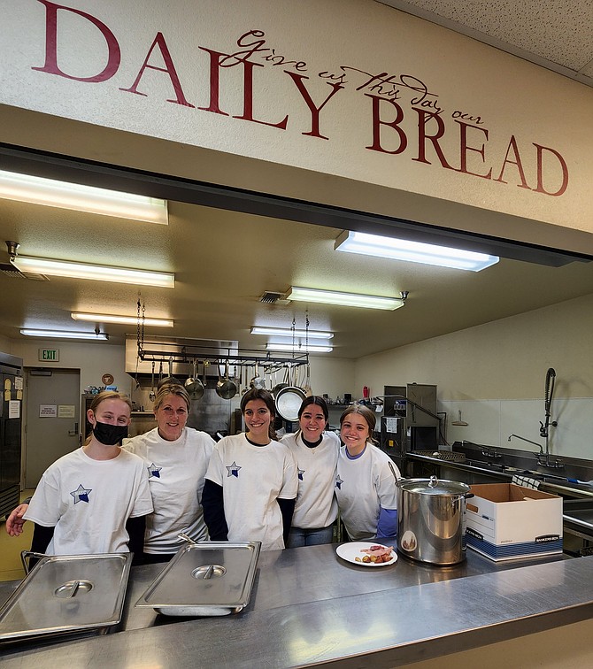 Student Council volunteers at Daily Bread. From left are Emily Bird, adviser Lisa Swan, Maria Cresp Paz, Anna Springfield and Halle Feest.