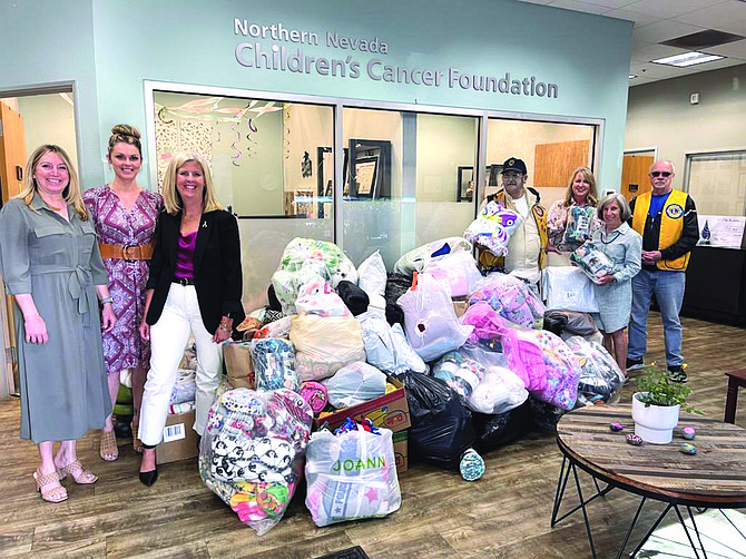 Carson Valley Lions with their haul of blankets for the Northern Nevada Children’s Cancer Foundation. Photo Special to The R-C