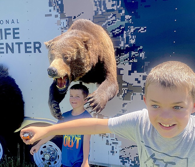 Two boys explore the wildlife exhibit at Carson Valley Youth Day on Saturday.