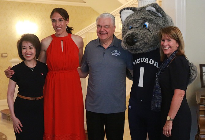 Rebecca Lobo, second from left, poses for a photo alongside Kathy Sisolak, far left, Governor Steve Sisolak, Nevada Wolf Pack mascot Alfie and Nevada athletic director Stephanie Rempe.