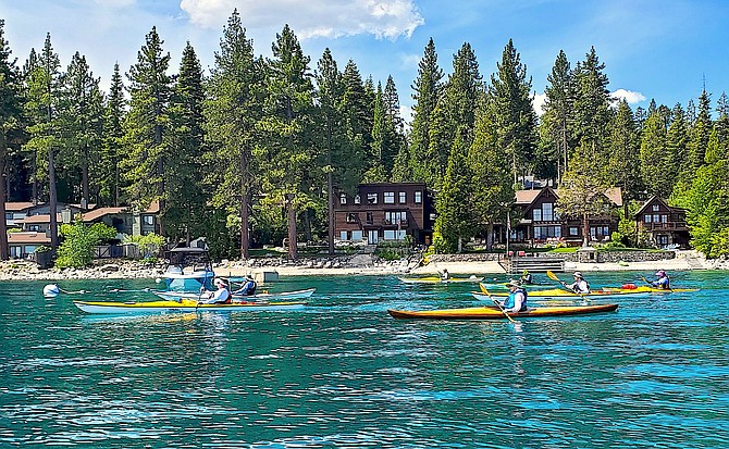 Kayakers paddle near McKinney Bay on Day 3 of the Circumnavigation of Lake Tahoe.