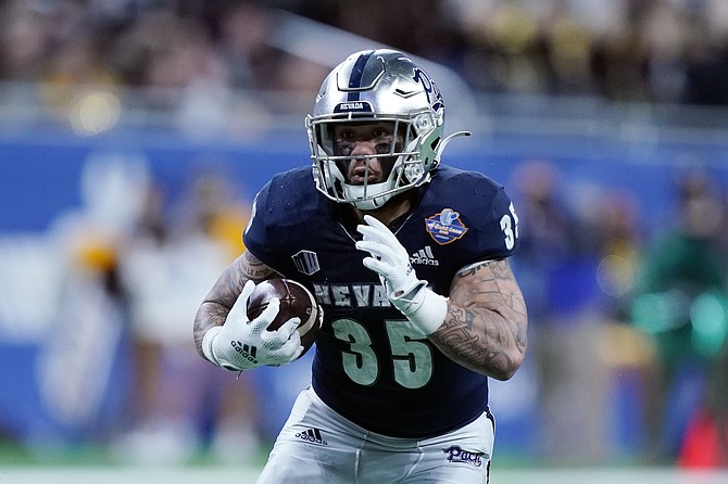 Nevada running back Toa Taua rushes during the Quick Lane Bowl against Western Michigan on Dec. 27, 2021, in Detroit.