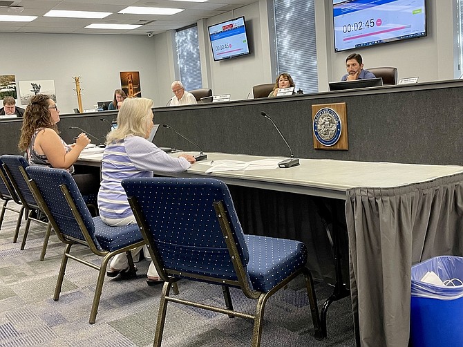 Carson City resident Jeannie White, 89, seated to the right, expresses her concerns about a proposed marijuana dispensary near her Bennett Avenue home during Wednesday’s Carson City Planning Commission meeting.