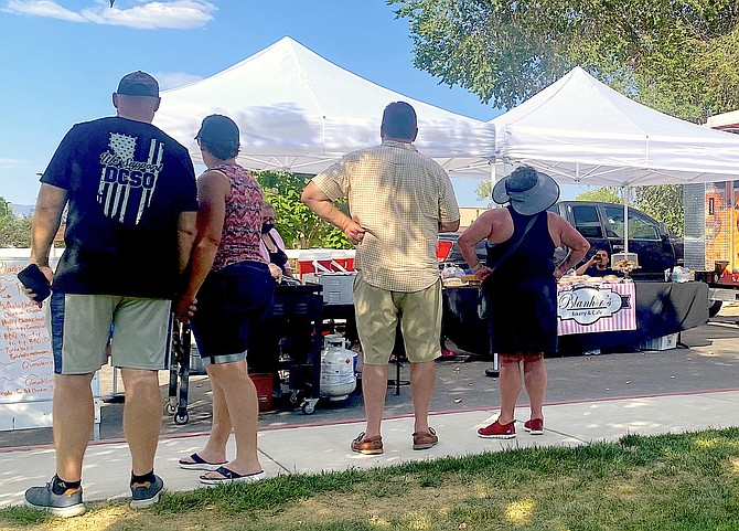 Visitors line up at Wednesday's Wind Down Wednesday at Heritage Park in Gardnerville. Tuesday will see CV Flyte attending Tuesday's National Night Out in Minden's Ironwood Center.