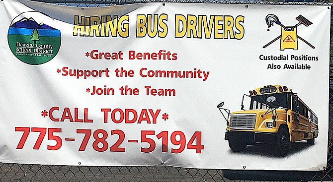 A yellow banner at Carson Valley Middle School is advertising for bus drivers.