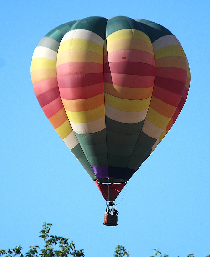 A ballon descends over Gardnerville on Monday morning.